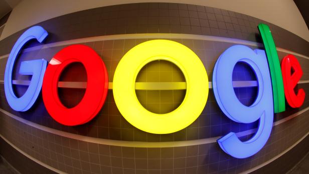 FILE PHOTO: An illuminated Google logo inside an office building in Zurich