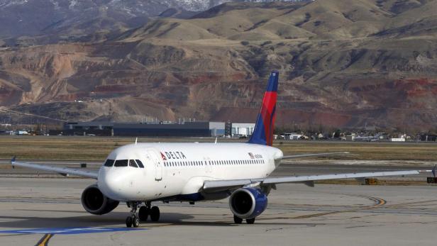 A Delta Airlines passenger jet taxis at the Salt L