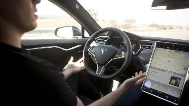 New Autopilot features are demonstrated in a Tesla Model S during a Tesla event in Palo Alto