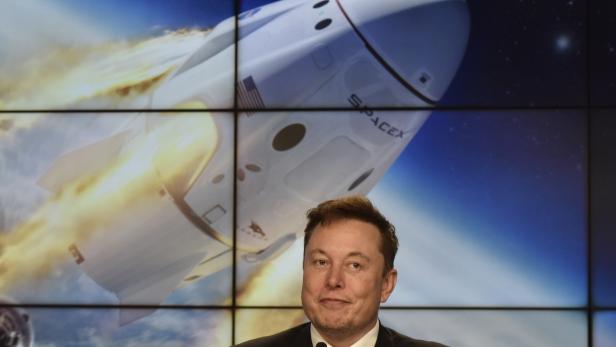 SpaceX founder and chief engineer Elon Musk attends a post-launch news conference to discuss the  SpaceX Crew Dragon astronaut capsule in-flight abort test at the Kennedy Space Center