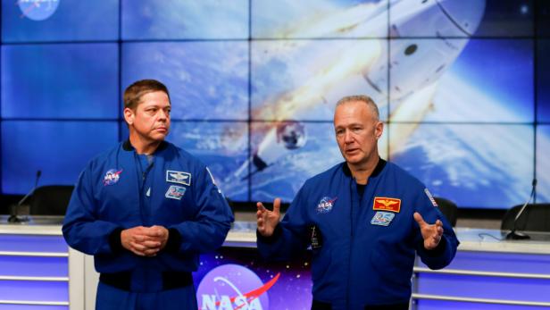 NASA astronauts Doug Hurley (R) and Bob Behnken speak at a news conference