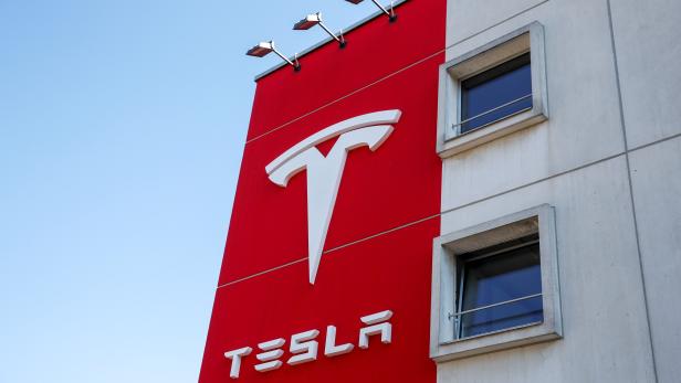Logo of Tesla is seen at a branch office in Bern