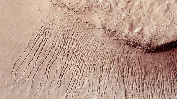 Portions of the Martian surface are pictured from NASA's Mars Reconnaissance Orbiter