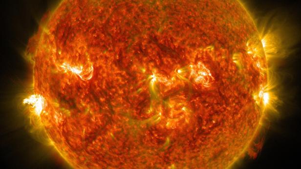 The sun emits a mid-level solar flare which erupted on the left side of the sun