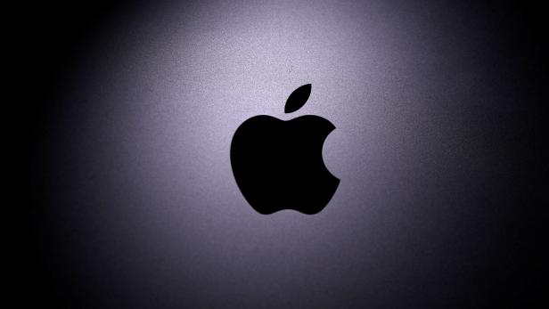 FILE PHOTO: Apple logo is seen on the Macbook in this illustration taken