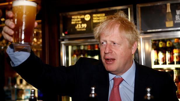 FILE PHOTO: Boris Johnson meets JD Wetherspoon chairman Tim Martin at Wetherspoons Metropolitan Bar in London