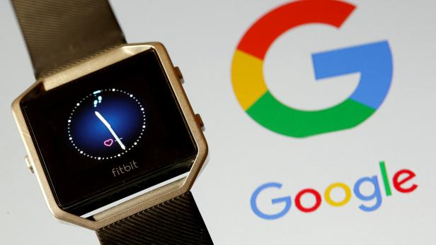 FILE PHOTO: Fitbit Blaze watch is seen in front of a displayed Google logo in this illustration