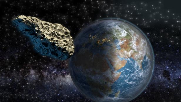 Ein Asteroid nähert sich der Erde vor einem Sternenhintergrund.