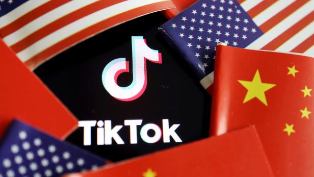 FILE PHOTO: Illustration picture of Tiktok with U.S. and Chinese flags