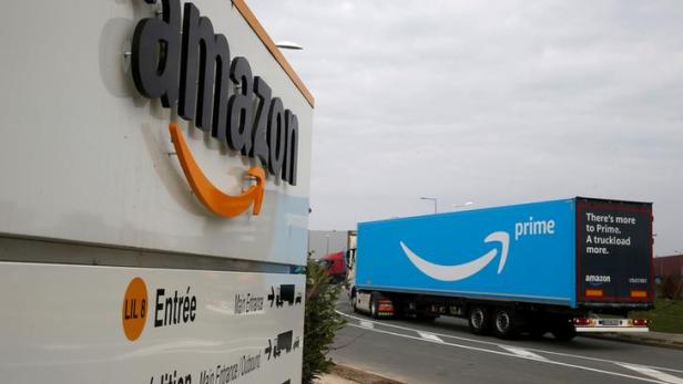 FILE PHOTO: A truck bearing the Amazon Prime logo arrives at the Amazon logistics center in Lauwin-Planque