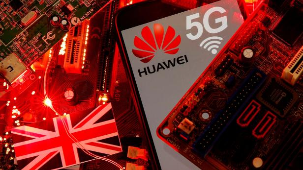 FILE PHOTO: The British flag and a smartphone with a Huawei and 5G network logo are seen on a PC motherboard in this illustration