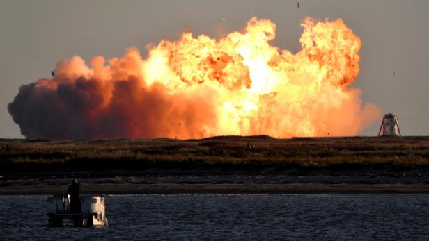 SpaceX's first super heavy-lift Starship SN8 rocket explodes during a return-landing attempt after it launched from their facility on a test flight in Boca Chica, Texas