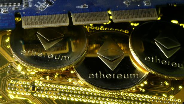 FILE PHOTO: Representations of the Ethereum virtual currency standing on the PC motherboard are seen in this illustration picture