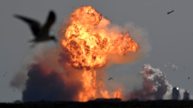 The SpaceX Starship SN9 explodes into a fireball after its high altitude test flight from test facilities in Boca Chica