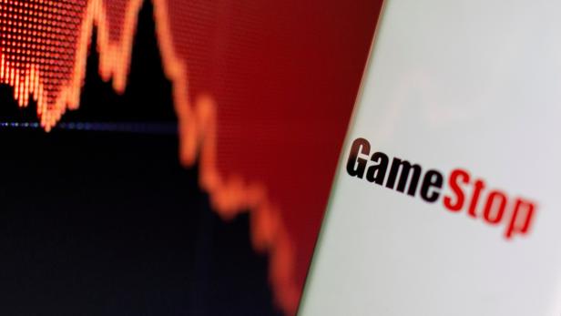 FILE PHOTO: GameStop logo is seen near displayed stock graph in this illustration