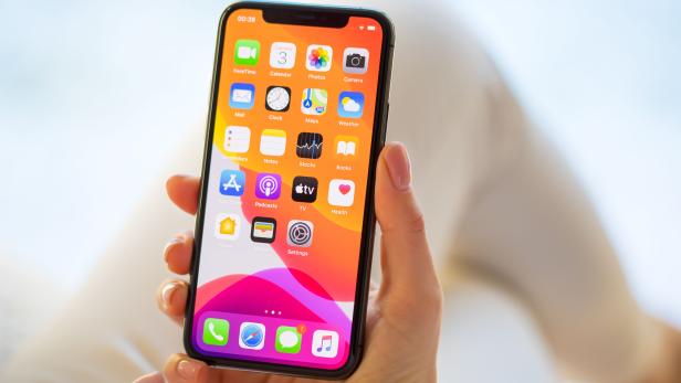 Woman using Apple iPhone 11 Pro smartphone