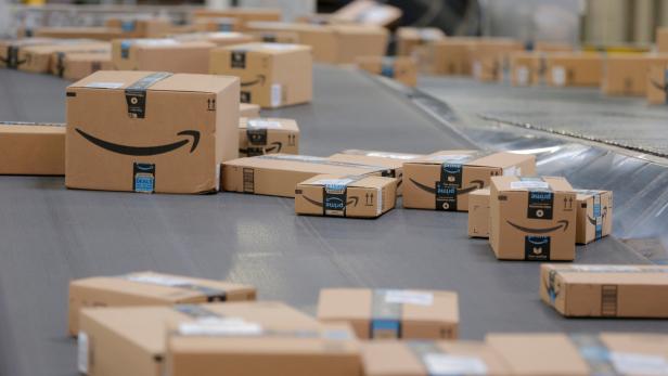 FILE PHOTO: Packages travel along a conveyor belt inside of an Amazon fulfillment center in Robbinsville, New Jersey
