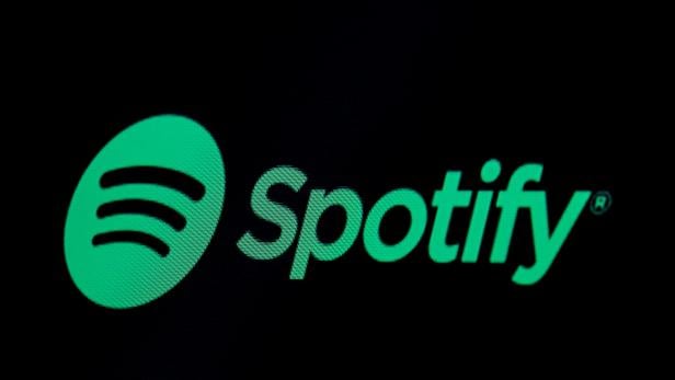 FILE PHOTO: FILE PHOTO: The Spotify logo is displayed on a screen on the floor of the NYSE in New York