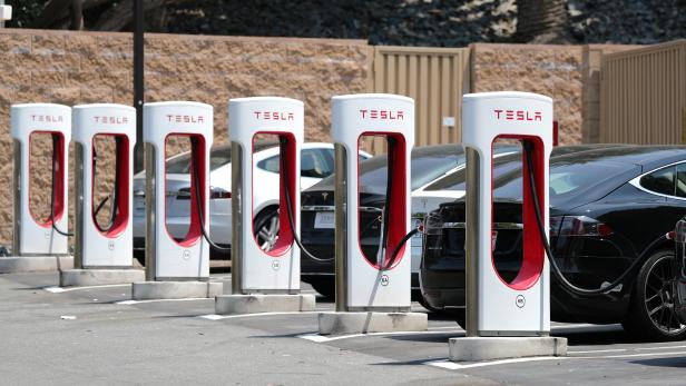FILE PHOTO: A Tesla electric car supercharger station is seen in Los Angeles