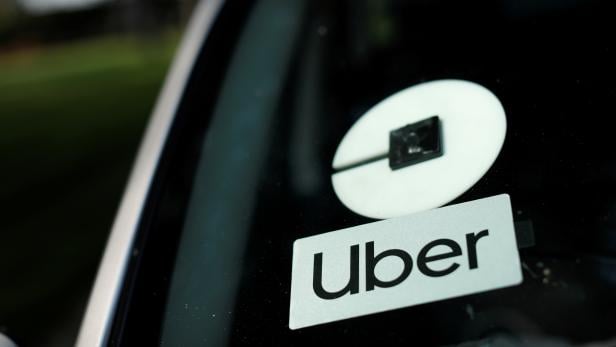 FILE PHOTO: An Uber logo is shown on a rideshare vehicle