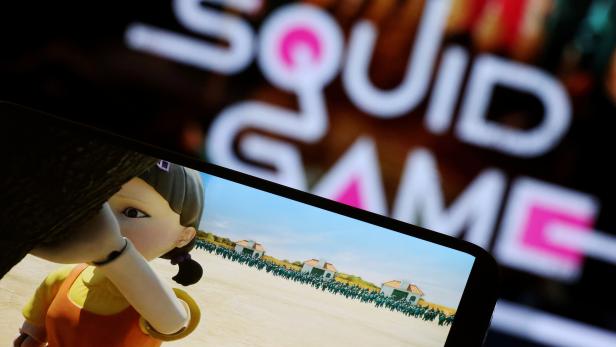 FILE PHOTO: The Netflix series "Squid Game" is played on a mobile phone in this picture illustration