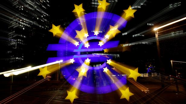 FILE PHOTO: The euro sign is photographed in front of the former headquarters of the European Central Bank in Frankfurt