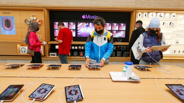 People check the products at an Apple store in Istanbul