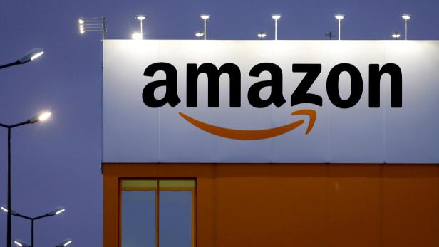 FILE PHOTO: The logo of Amazon is seen at the company logistics center in Lauwin-Planque, northern France