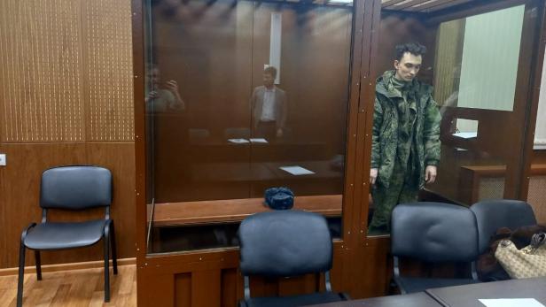 Artyom Zayets, detained on suspicion of the illegal circulation of means of payment, attends a court hearing in Moscow