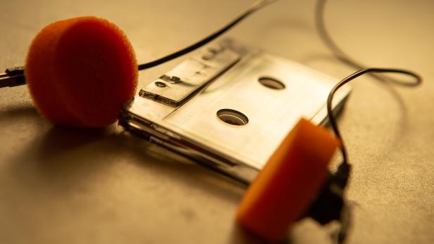 Music listening concept. Vintage cassette tape, audio player and headphones. retro color