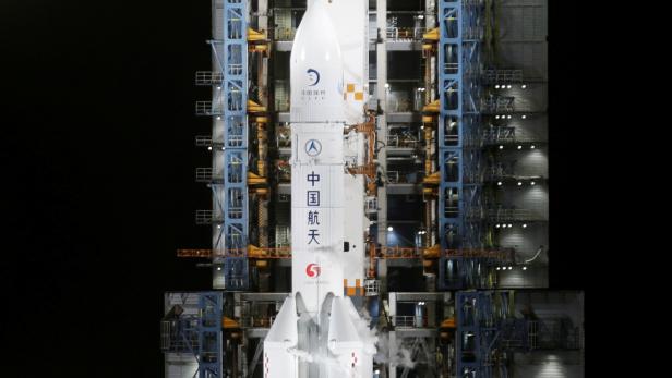 FILE PHOTO: The Long March-5 Y5 rocket, carrying the Chang'e-5 lunar probe, is seen before taking off from Wenchang Space Launch Center, in Wenchang