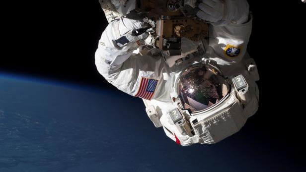 FILE PHOTO: NASA handout shows NASA Expedition 35 Flight Engineers Cassidy and Marshburn conducting a spacewalk to inspect and replace a pump controller box on the International Space Station's far port truss
