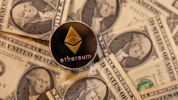 Illustration shows representation of virtual cryptocurrency Ethereum and U.S. dollar banknotes