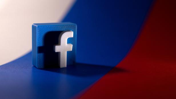 FILE PHOTO: Illustration shows Facebook logo and Russian flag