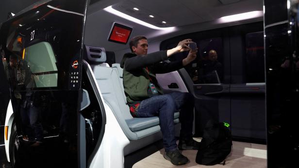 FILE PHOTO: An attendee takes a selfie inside a Cruise Origin autonomous vehicle during its unveiling in San Francisco