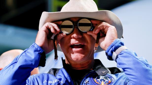 FILE PHOTO: Blue Origin's Bezos wears goggles owned by Amelia Earhart which he carried into space