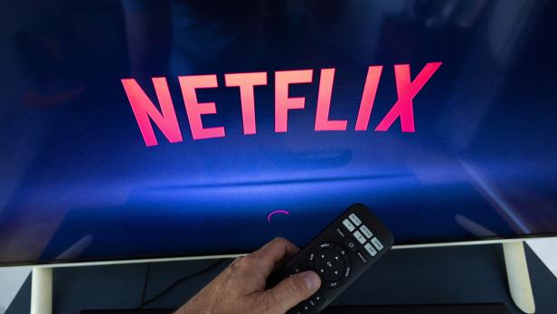 A Netflix logo is shown on a TV screen ahead of a Swiss vote, in this illustration