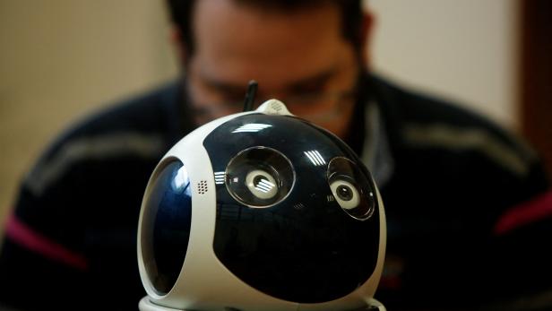 FILE PHOTO: A research support officer and PhD student works on his artificial intelligence project to train robots to autonomously carry out various tasks, at the Department of Artificial Intelligence at the University of Malta in Msida