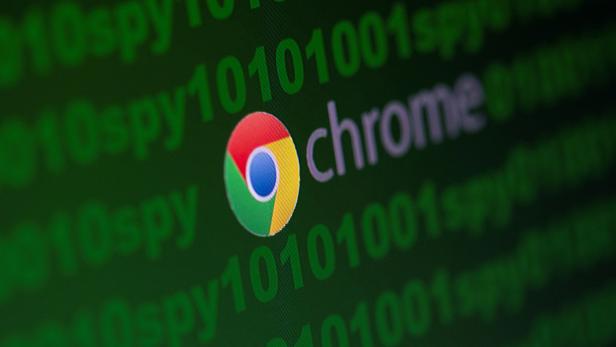 FILE PHOTO: Google Chrome logo is seen near cyber code and words "spy"  in this illustration picture