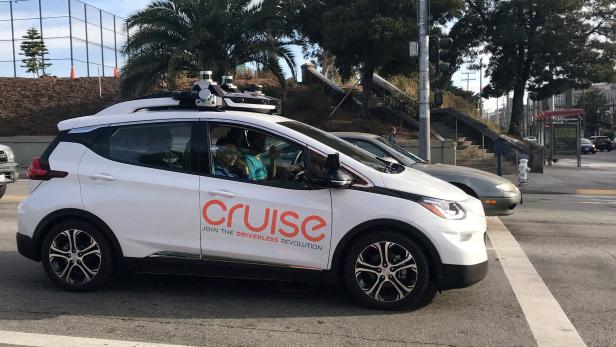 FILE PHOTO: A Cruise self-driving car, which is owned by General Motors Corp, is seen outside the companys headquarters in San Francisco