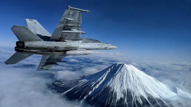 FILE PHOTO: A U.S. Navy F/A-18F Super Hornet flies past Mount Fuji