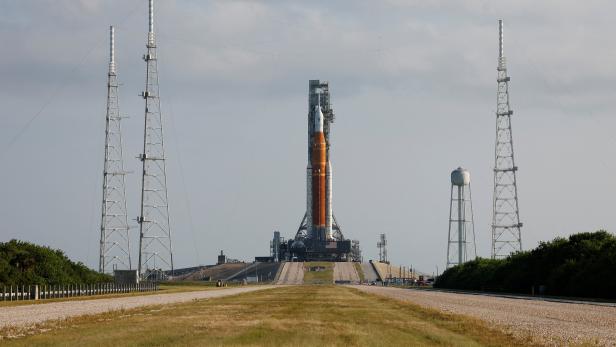 NASA's next-generation moon rocket, the SLS  Artemis 1 rocket with its Orion crew capsule perched on top, leaves the Vehicle Assembly Building