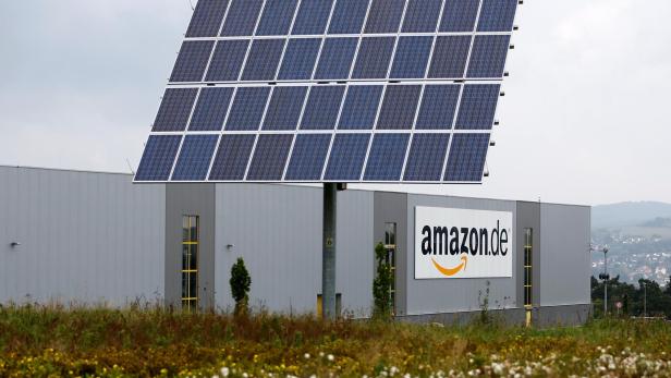 FILE PHOTO: Solar panels stand in front of the Amazon distribution centre in Bad Hersfeld