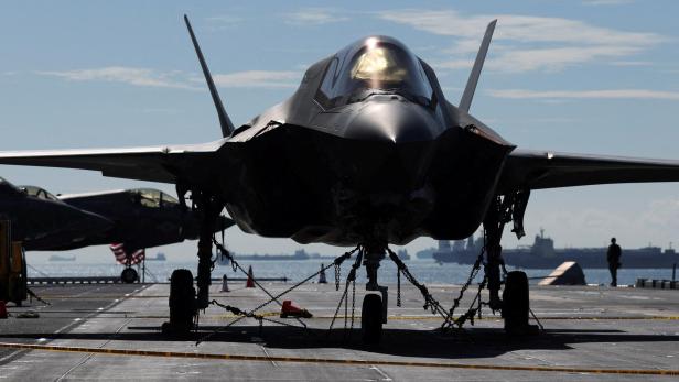FILE PHOTO: Lockheed Martin F-35 Lightning II aircrafts are seen on the flight deck of amphibious assault ship USS Tripoli (LHA-7) at Changi Naval Base in Singapore