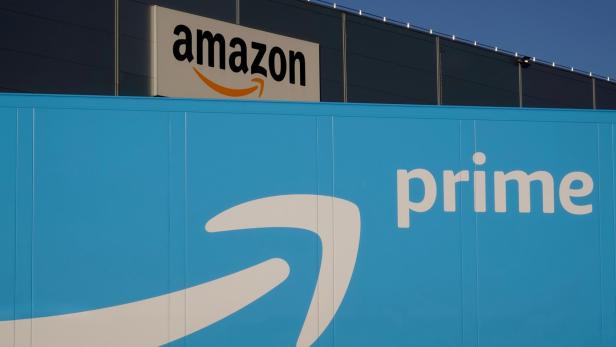 FILE PHOTO: The logo of Amazon Prime Delivery is seen on the trailer of a truck outside the company logistics center in Lauwin-Planque