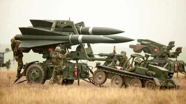 FILE PHOTO: Romanian Army soldiers deploy a HAWK PIP III R ground-to-air missile launch pad during a joint military exercise with the US Army that aimed to test the interoperability of U.S. and Romanian armed forces in the event of a missile attack, near C