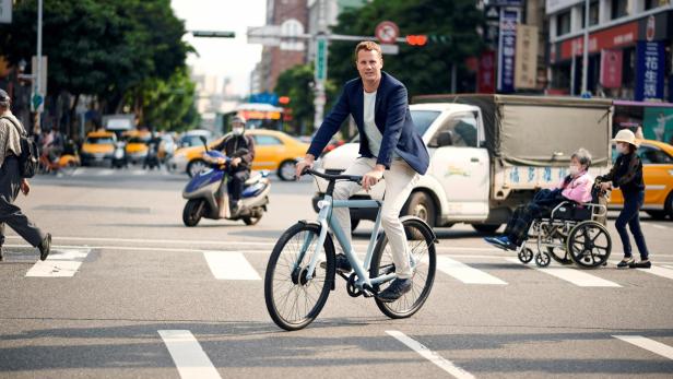 FILE PHOTO: Ties Carlier, co-founder of Dutch electric bike maker Vanmoof, rides a bike