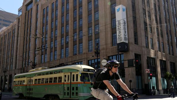 FILE PHOTO: A vintage streetcar passes in front of the Twitter headquarters on Market Street in San Francisco