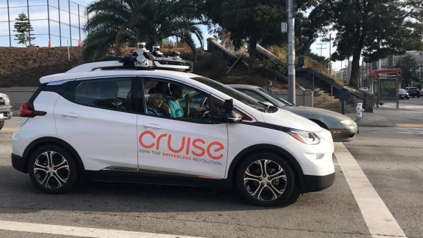FILE PHOTO: A Cruise self-driving car, which is owned by General Motors Corp, is seen outside the companys headquarters in San Francisco