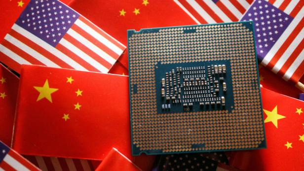 FILE PHOTO: Illustration picture of Chinese and U.S. flags with semiconductor chip